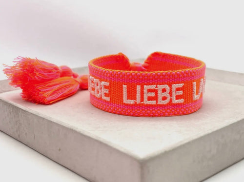 Webarmband "Lebe Liebe Lache" neon orange/neon pink