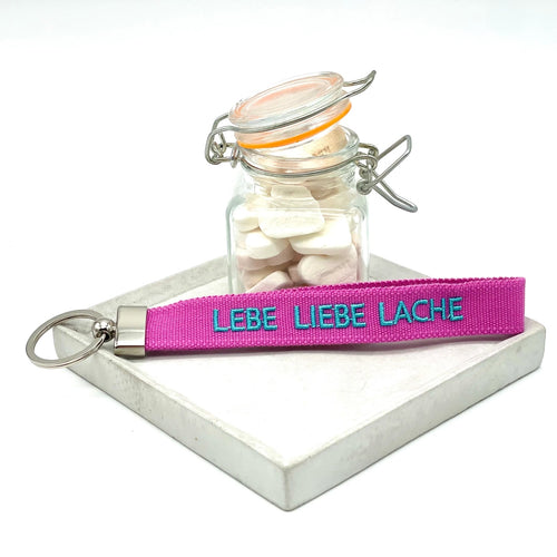 Key Ring "Lebe Liebe Lache" magenta/türkis